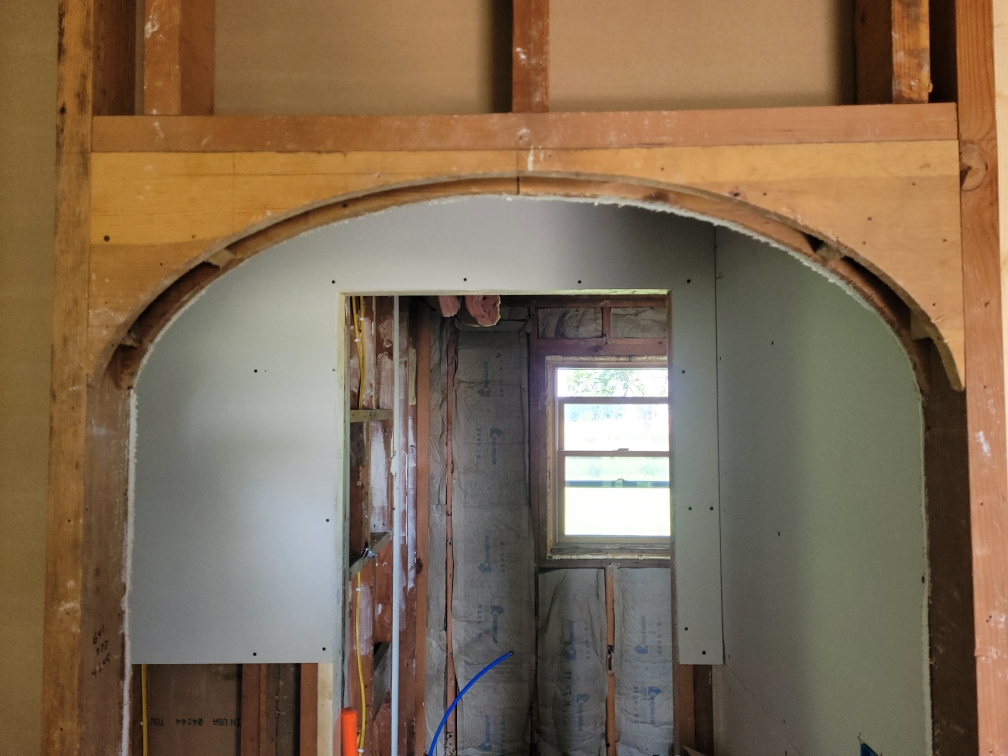 Interior remodel with arch doorway